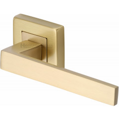 Delta Lever Handles on Square Rose in Satin Brass