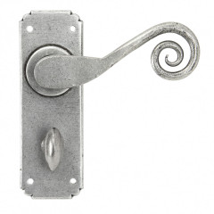 Monkeytail Door Lever Handles On Bathroom Backplate Pewter