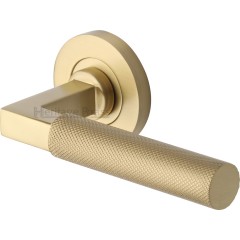 Signac Knurled Lever Handles on Rose in Satin Brass