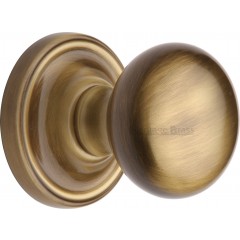 Hampstead Bun Door Knobs in Antique Brass