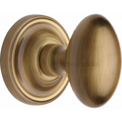 Chelsea Oval Door Knobs in Antique Brass