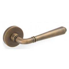 Valli H1037 Lever Handles on Round Rose in Antique Brass