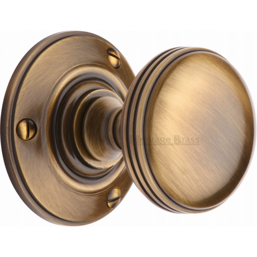 Period Half Reeded Mortice Door Knobs on Rose in Antique Brass from