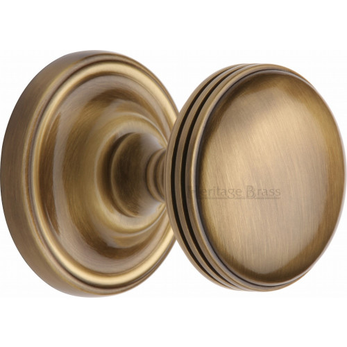 Modern Half Reeded Mortice Door Knobs on Rose in Antique Brass from