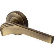 Tiffany Deco Lever Handles on Rose in Antique Brass
