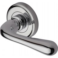 Charlbury Designer Lever Handles on Rose in Polished Chrome