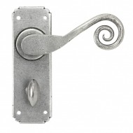 Monkeytail Door Lever Handles On Bathroom Backplate Pewter