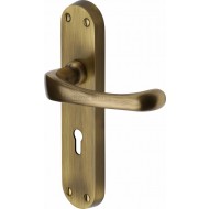 Gloucester Lever Handles on Backplate in Antique Brass