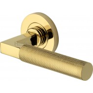 Signac Knurled Lever Handles on Rose in Polished Brass