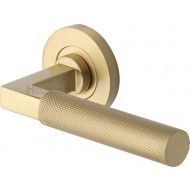 Signac Knurled Lever Handles on Rose in Satin Brass