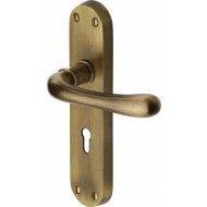 Luna Lever Handles on Backplate in Antique Brass