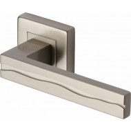 Amazon Lever Handles on Square Rose in Satin Nickel