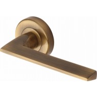 Pyramid Straight Lever Handles on Rose in Antique Brass