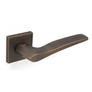 Valli Otello Lever Handles on Square Rose in Antique Brass