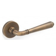Valli H1037 Lever Handles on Round Rose in Antique Brass