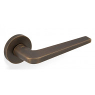 Valli H348 Lever Handles on Round Rose in Antique Brass